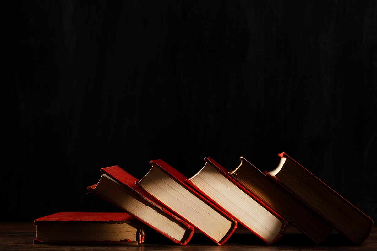 books assortment with dark background